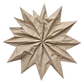 Brown paper origami star decoration on black background