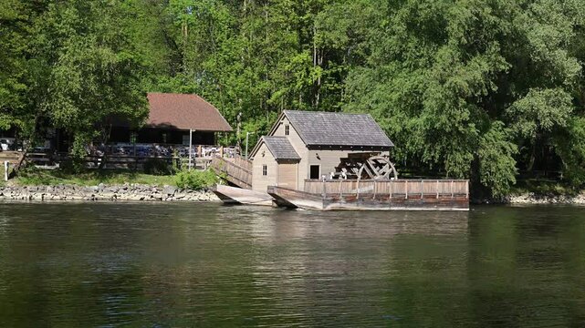 Mura River and floating mill near the village of Izakovci, Slovenia. The Mura (Mur) River is a major tributary of the Drava River, and in Slovenia it is known for its floodplain forests