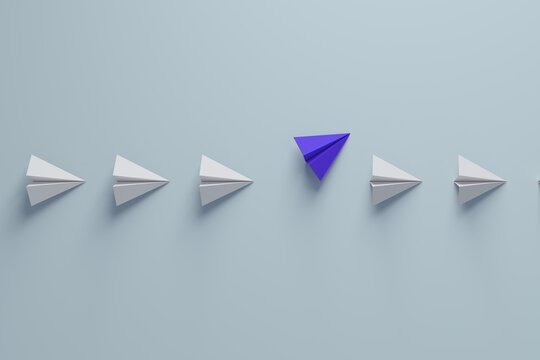 Purple paper plane deviating from white planes
