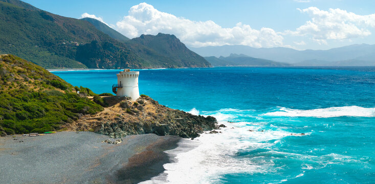 Albo beach Cap Corse Corsica France aerial drone panorama white Genoese tower black sand beach turquoise sea mountains landscape travel destination world print high resolution