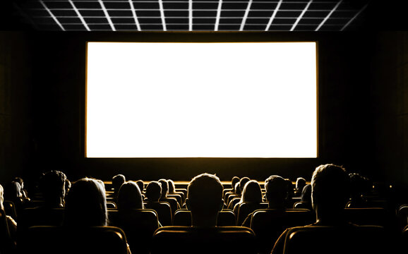 People in the cinema auditorium with empty white screen.
