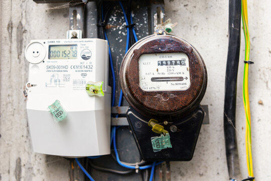 Old and new electric counters meters mounted on an industrial wall. Telsiai, Lithuania. 09-08-2026.