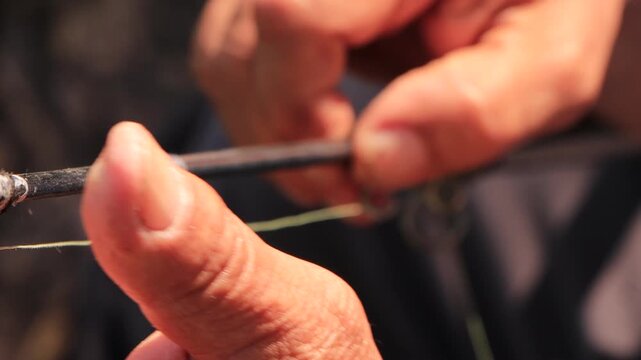 Process of preparing and setting up fishing rod outdoors