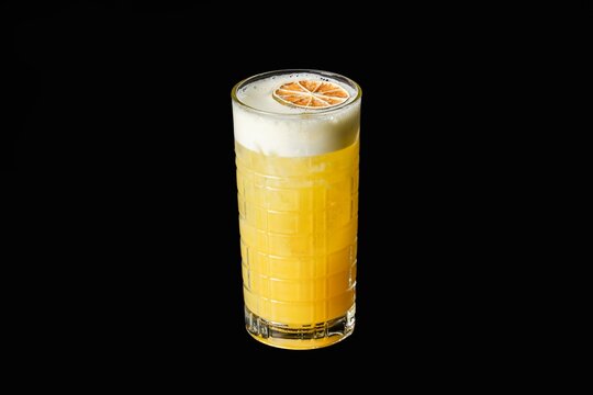 Citrus Cocktail with Foam and Dried Lime Slice