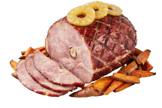 Glazed spiral sliced ham topped with pineapple rings and served with roasted sweet potato wedges on a white plate isolated on a transparent background