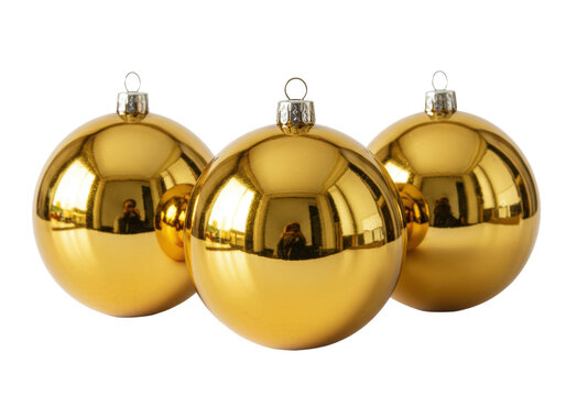 three identical, highly reflective 24k gold christmas baubles with silver caps, focused macro shot against a transparent studio background. luxurious holiday decor concept
