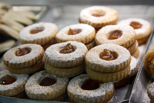 Assortment of delicious Sicilian pastries with almonds, chocolate drizzle, candied cherries and pistachio cream.