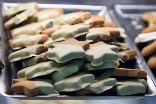 Assortment of delicious Sicilian pastries with almonds, chocolate drizzle, candied cherries and pistachio cream.