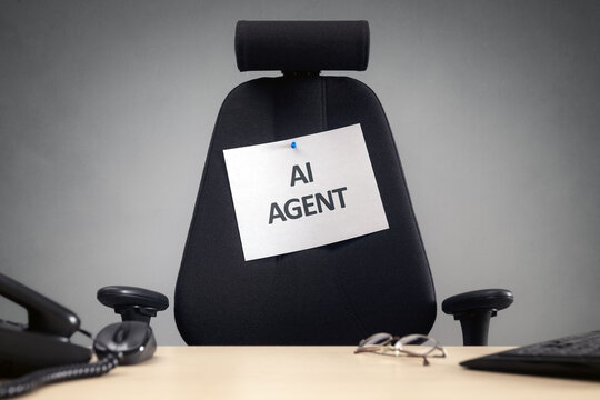 Empty office chair with AI Agent sign business concept for artificial intelligence replacing people in the workforce