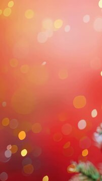 Festive image showing a Christmas tree decorated with red and gold ornaments against a red backdrop with bokeh lights. The decorations create a warm and joyful holiday atmosphere, full of cheer.