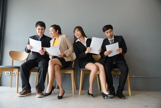 Group of professional businesspeople meeting and review documents in workplace. Teamwork, colleagues and employee, with businessmen and businesswomen working together in corporate business office