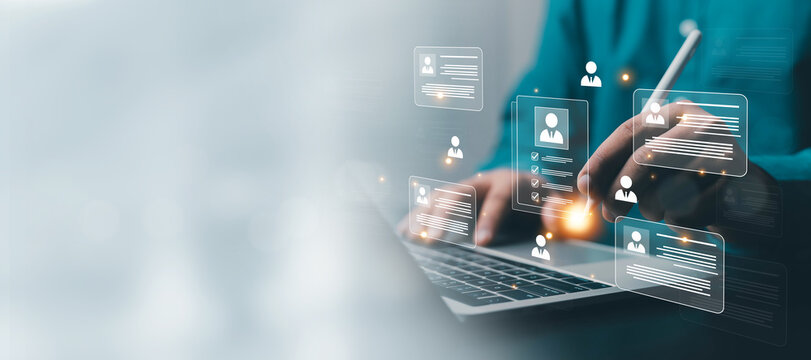 Business professional using a laptop with digital candidate profiles and hiring cards, representing recruitment, talent acquisition, human resources, screening, workforce planning, and HR technology.
