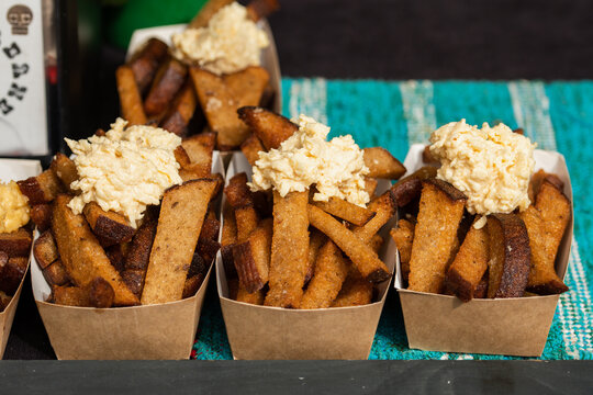 Fried rye bread crostini or kepta duona, typical of Lithuanian cuisine, served with a creamy cheese or garlic-based sauce