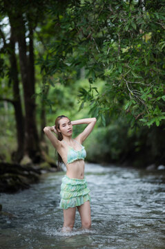 young woman in Green bikini on the Stream