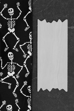 Halloween background with skeletons border on black marble for celebration events