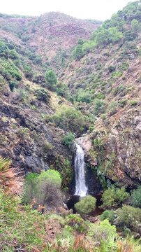 Hiking trail to waterfalls over river Caballos, Sierra de la Nieves National Park in Tolox, Malaga, Spain