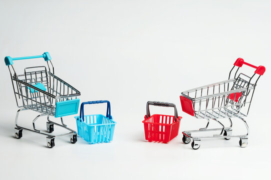 Blue and red shopping basket and trolleys