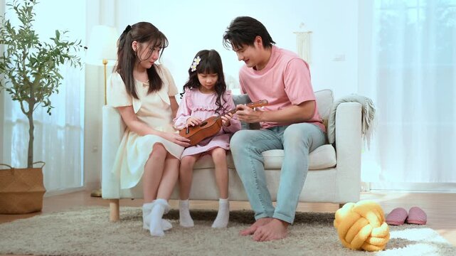 Family Enjoys Time Together While Playing Music in Their Living Room