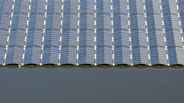 Aerial view of the floating solar farm at Lippe Gabriels Plas, featuring rows of photovoltaic panels on the water surface in Ureterp, Friesland, Netherlands.