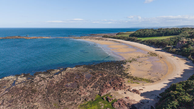 Scenic sandy bay of Seacliff Beach with rocky coast in North Berwick Scotland