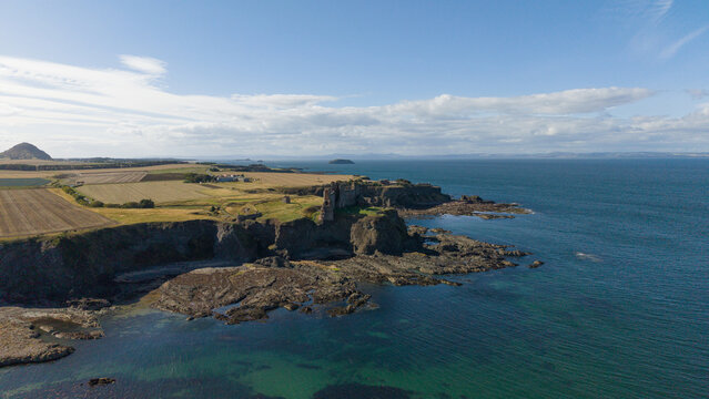 Aerial view of medieval Tantallon Castle ruins on coastal cliffs in North Berwick Scotland