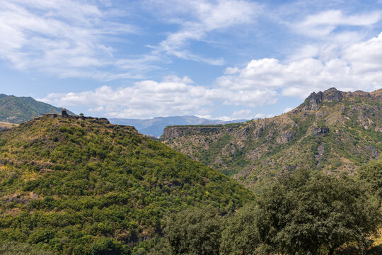 Scenic landscape photography featuring ancient Kayan Fortress placed on top of a mountain. Historic landmark of Zarni-Parni, Haghpat, Lori Province of Armenia