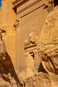 Nabataean tomb facade carved into a sandstone cliff at Hegra, Al Madinah Province, Alula, Saudi Arabia