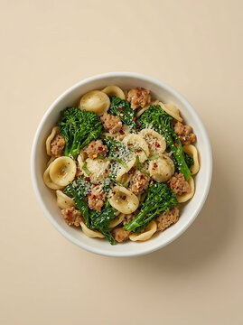 Bowl of orecchiette pasta with sausage and broccoli rabe