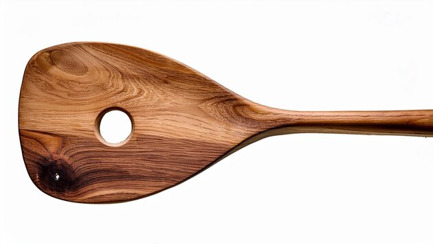 a wooden paddle with a hole in the middle