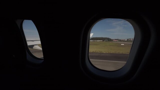 Quiet Airport View Through Airplane Cabin Windows