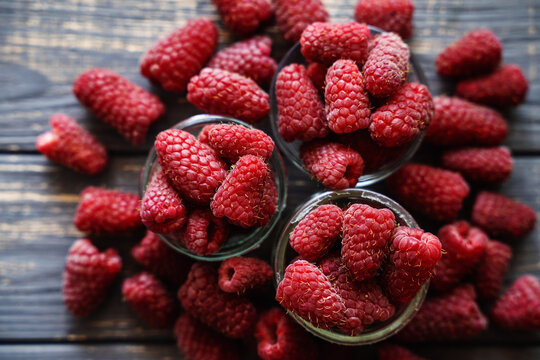 organic raspberries on wooden table background, food blogging, healthy eating concepts, and seasonal summer harvest themes. Small Farm food	