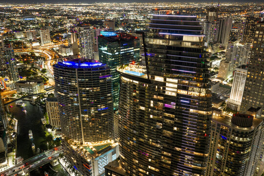 Miami skyscrapers on the river at night aerial stock photo