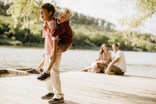 Joyful moments of playfulness by the lakeside with family and friends