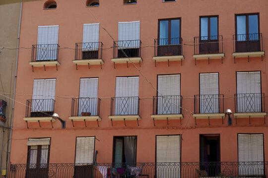 Colorful Spanish urban architecture with balconies and street scenes