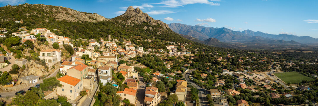 Lumio Corsica France aerial drone 3:1 panorama sunny stone houses mountain background Balagne region authentic village travel destination world print high resolution