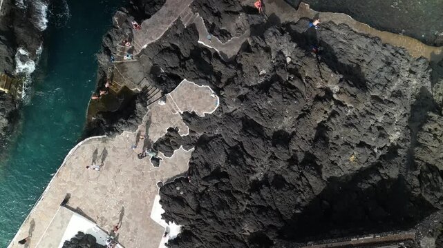 Aerial drone view of the natural lava pools of El Calet&oacute;n in Garachico, northern Tenerife, Canary Islands, Spain. Scenic flight over volcanic rock formations, ocean pools and the rugged Atlantic coast