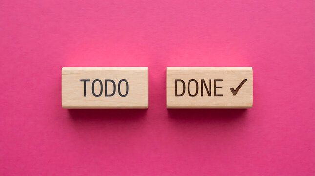 Two wooden blocks placed side by side on a vibrant pink background, with the left block labeled todo and the right block labeled done with a checkmark, representing task management and completion