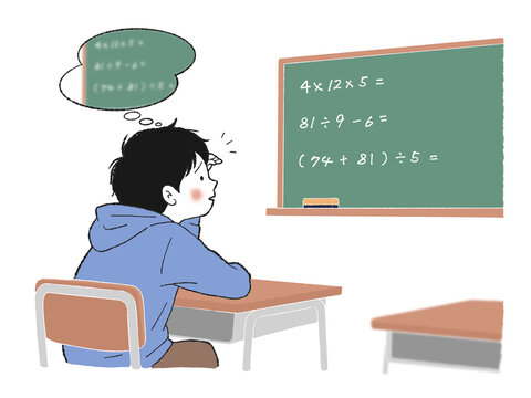 黒板の文字が見えづらく困る小学生の男の子
