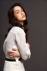 Obraz premium Beautiful young woman shows stylish fashion in a captivating pose with elegance