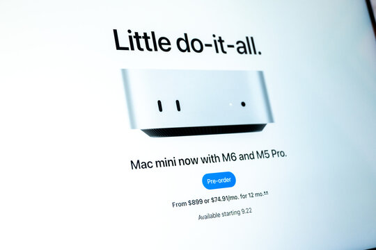 Mac mini computer displaying new product advertisement