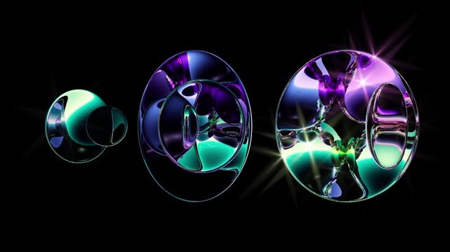 Floating glass spheres refract vivid metallic abstract elements on a black background. Elegant looped animation for luxury branding, innovation, and futuristic design.