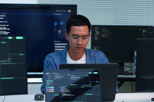 Focused Programmer Developing Digital Solutions with Code