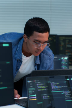 Focused Programmer Working on Digital Code