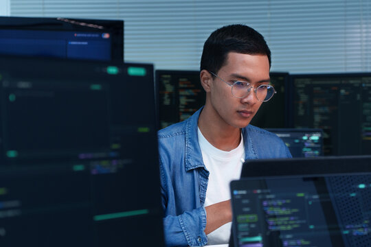 Focused Programmer Developing Digital Software