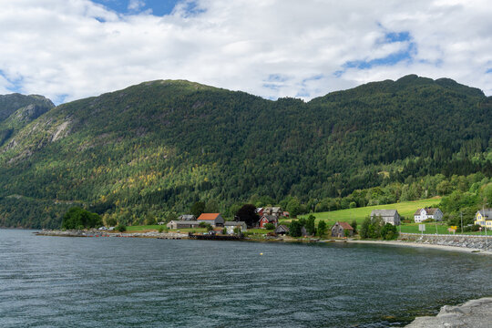 Lote village at Nordfjord with forested mountains