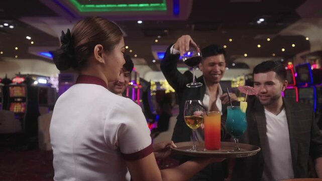 Actual footage of casino players picking drinks before starting the roulette game play.