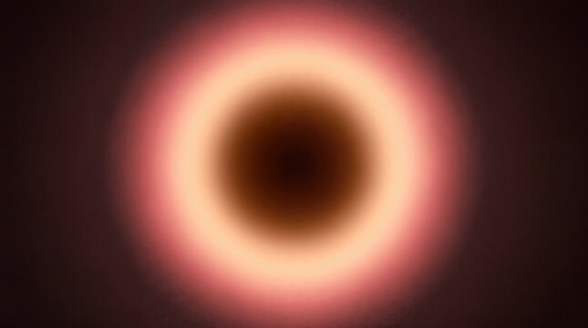 Circular light gradient with a dark center surrounded by glowing pink and orange rings