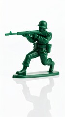 Obraz premium Green Plastic Toy Soldier Figurine Aiming Rifle on White Background