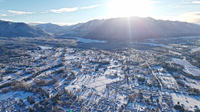 Unusual snow-covered landscape of Melipeuco, illuminated by sunlight, Chile. Aerial