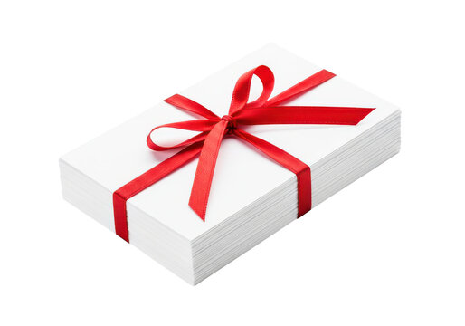 Stack of white cards tied with red ribbon and bow for gift or greeting celebration.
